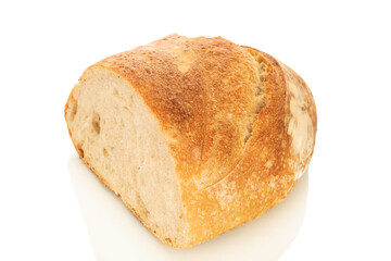 One half of a loaf of bread isolated on a white background, close-up.