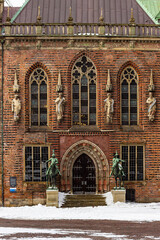 Townhall entrance with equestrian herald statues in winter, Bremen, Germany