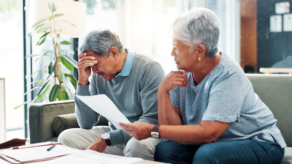 Stress, finance documents and senior couple in home with debt, mortgage or bills with budget...