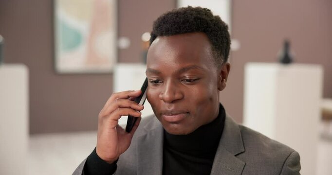 Art gallery, phone call and happy black man with discussion, culture and networking for creative business. Exhibition, critic or curator on mobile at studio, auction or showroom with communication