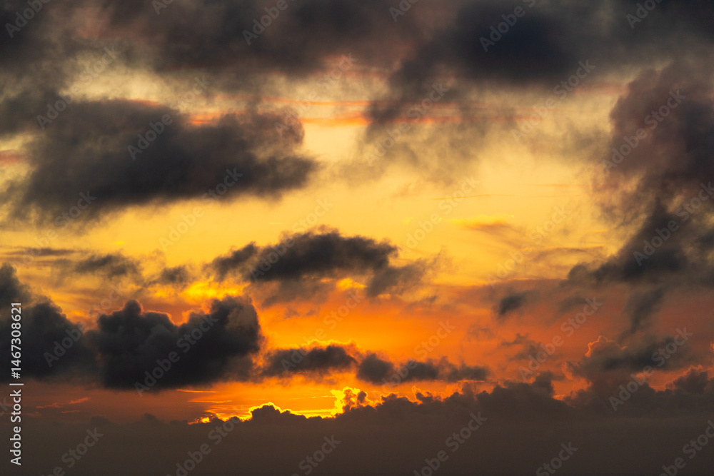 Poster sky with colorful pink golden and dark clouds at sunset. abstract texture background pattern.