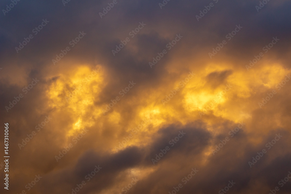 Wall mural sky with stormy dark clouds at sunset. abstract texture background pattern.