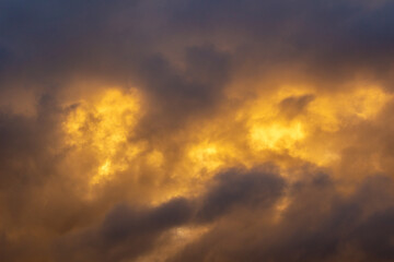 Fototapeta premium Sky with Stormy Dark Clouds at Sunset. Abstract Texture Background Pattern.