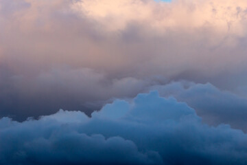 Obraz premium Sky with Stormy Dark Dramatic Blue Clouds. Abstract Texture Background Pattern.