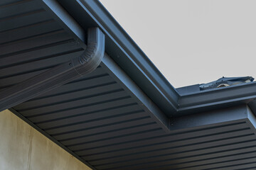 Close-up view showcases a contemporary roof edge with a smooth finish, highlighting architectural...