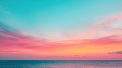 Fototapeta premium A serene seascape featuring vibrant hues of pink and turquoise as the sun sets, creating a tranquil atmosphere.