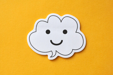 Speech balloons with a happy smiley face, positivity, optimism and joy of life