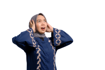 Angry young Asian Muslim woman screaming covering ears with both hands, distressed by noise isolated on transparent background