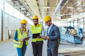 Team Collaboration in Industrial Warehouse Setting with Safety Equipment