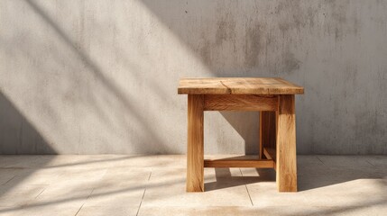 Sunlit wooden table casting soft shadows on tan concrete floor in a minimalist modern interior design setting
