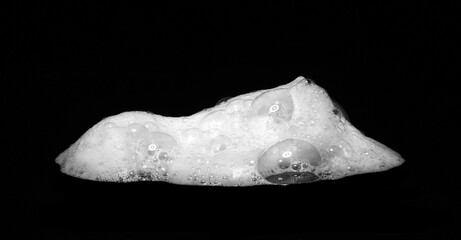 Liquid white foam from soap, shampoo or bath foam. Abstract soap bubbles. Set of soap bubbles....