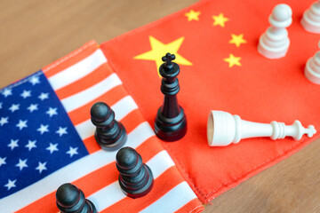 Chess kings standing on US and China flags  symbolizing economic tension, tariffs, and power...