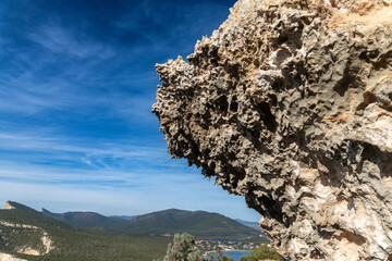 Limestone Cliff with Eroded Surface Over Valley at Capo Caccia