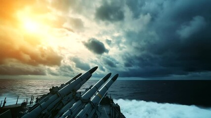 A dramatic close-up of missiles mounted on the deck of a European warship, against a backdrop of open ocean and dark clouds, illustrating naval defense readiness in global security