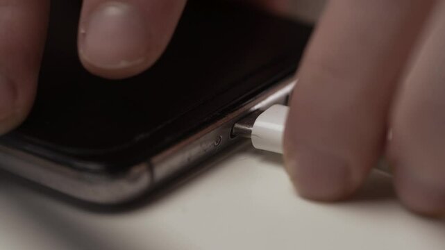 Close Up of Type-C Cable Plugging into Smartphone Charging Port at Home