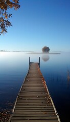 Fototapeta premium Serene lake landscape showcasing a rustic wooden dock and calm water reflections at dusk