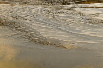 Silt and sand after the ebb tide of the North Sea. It looks like the relief of the Sahara Desert.