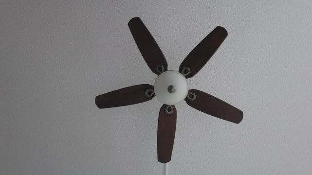 Celling fan stop spining heavy wooden fins front look
