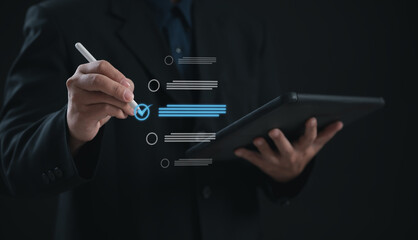 Digital Assessment Concept : Businessman Uses tablet for Evaluation, Survey Exam, Survey Completion, and Checklist or Fills Assessment Survey for Performance Checklist.	