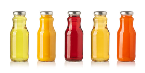 Five colorful juice bottles standing in a row on white background
