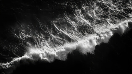 High contrast aerial view of tidal waves revealing intricate patterns of water movement