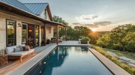 Obraz premium Stunning modern farmhouse with pool and sunset view