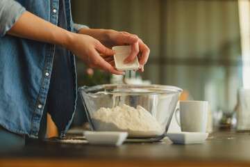 Cooking homemade pizza. Female hands making dough, adding sauce and ingredients.