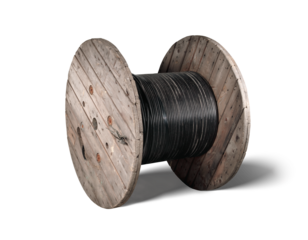 Isolated fiber optic wooden cable reel. Large 1000m loose tube cable wood drum. High-speed internet upgrade or installation of fiber optic in building or underground. Selective focus.