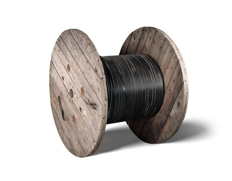 Isolated fiber optic wooden cable reel. Large 1000m loose tube cable wood drum. High-speed internet upgrade or installation of fiber optic in building or underground. Selective focus.