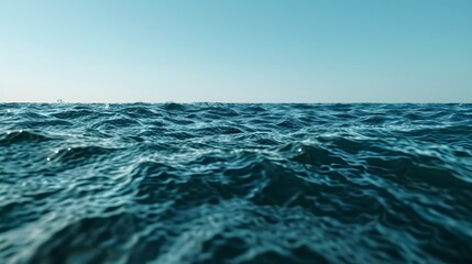 Calm Ocean Waves Under Clear Blue Sky at Sunrise or Sunset on Serene Seaside Horizon