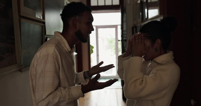 Couple, hallway and frustrated with conflict, stress and drama at home or apartment. Argument, woman and man with fight, angry and dispute with toxic marriage and mistake or crisis with partner