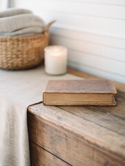 Fototapeta premium A rustic wooden table adorned with a vintage book, candle, and woven basket in a cozy setting