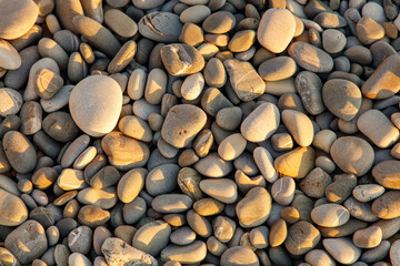 A pile of rocks with a sun shining on them