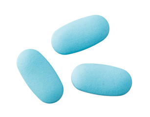 Three light blue pills falling on transparent background