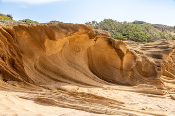 Wind-eroded sandstone cliffs near Portu Maga Sardinia