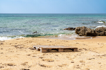Wooden Pallet on Sandy Portu Maga Beach Shore
