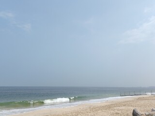 Water waves Sea Shore Beautiful Panorama white sand beach and turquoise water View.
Holiday summer beach background, Wave of sea on White sandy beach. Enjoy Holiday on Public Beach Heavy Water Waves