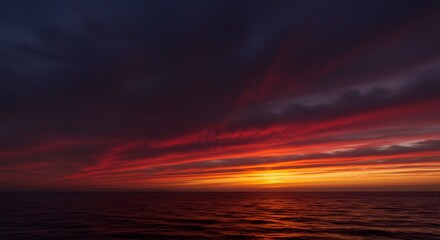 Obraz premium Vibrant sunset over the horizon with dynamic colors and gradient sky backdrop