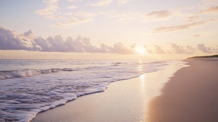 Serene Sunrise on a Sandy Shoreline Reflecting Light on Water Surface