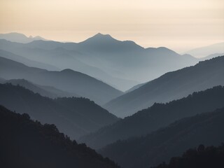 Fototapeta premium Serene landscape of layered mountains in soft blue hues at dawn.
