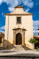 Fototapeta premium Church facade with stairs and cross in Niscemi