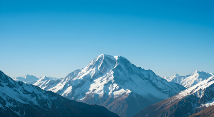 Obraz premium Majestic Snow-Capped Mountain Under Clear Blue Sky at Daylight