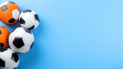 Fototapeta premium Colorful Soccer Balls on a Blue Background for Sports Themes