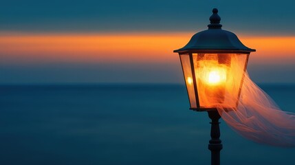 Illuminated lantern against sunset sea serene evening mood