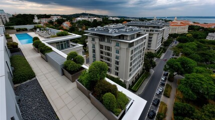 Fototapeta premium Modern luxury apartment rooftop terrace with swimming pool, greenery, city view, and overcast sky in an urban residential area