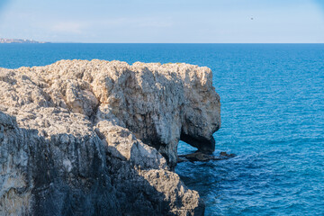 Coastal rock arch and cliffs near Syracuse, Elephant rock