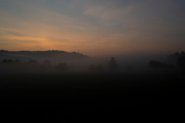 Ground fog at sunrise with Weitenburg Castle in the background in the landscape of the Neckar valley near Rottenburg am Neckar in Baden-W&uuml;rttemberg, Germany, Europe.