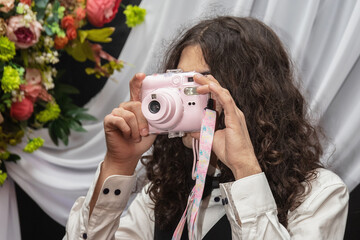 young photographer captures the moment with snap camera