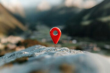 Red map pin on a rock, mountain backdrop