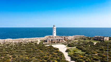 Lighthouse and ruins on coastal cliff near Syracuse